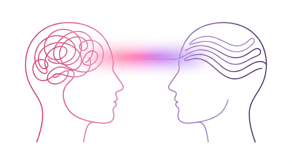 Two line drawn heads facing each other, one filled with pink tangled loops and one with calm purple waves, joined by a band of light